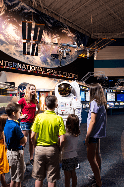 Have fun with interactive exhibits, touch a moon rock and meet Commander Quest. Photo courtesy of Space Center Houston.
