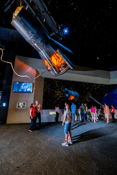 See flown spacecraft including the Gemini V capsule that housed astronauts Charles “Pete” Conrad and Gordon Cooper. Photo courtesy of Space Center Houston.