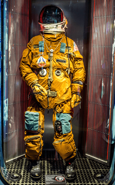 Walk among spacesuits worn by the women and men of America’s space program. See the escape suit worn by mission commander John Young during launch and landing aboard the first shuttle mission in 1981. Photo courtesy of Space Center Houston.